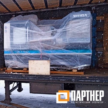  Фотография крепления токарного станка при помощи строп для транспортировки после боковой погрузки на фуру 